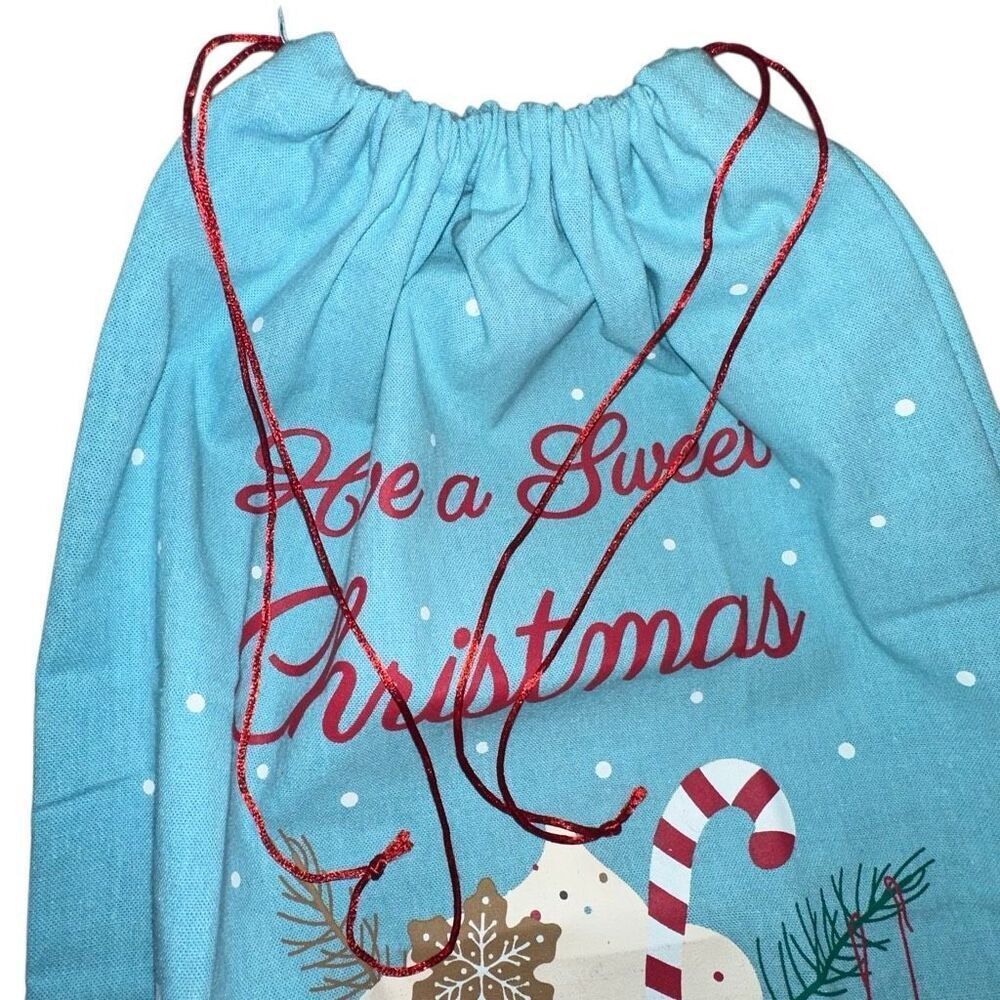 Santa canvas gift bag with hot cocoa have a sweet Christmas logo